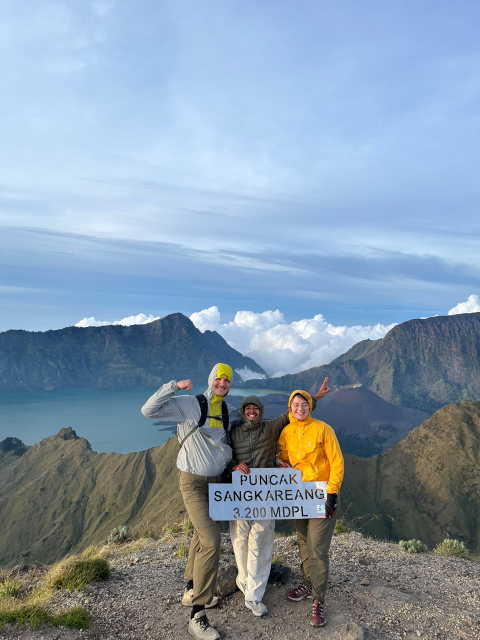 Hikers at Sangkareang summit, 3,200m, with Rinjani crater lake view